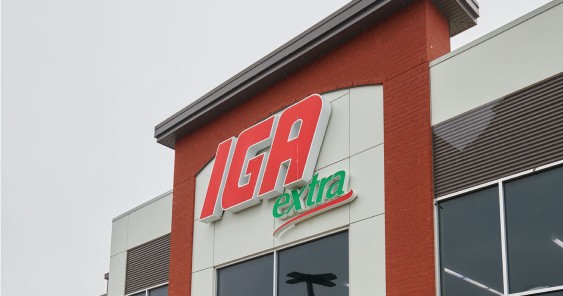 An image of a red & grey building with IGA Extra branding logo