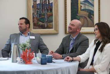 In this image, a group of Sobeys employees is discussing something together and laughing.