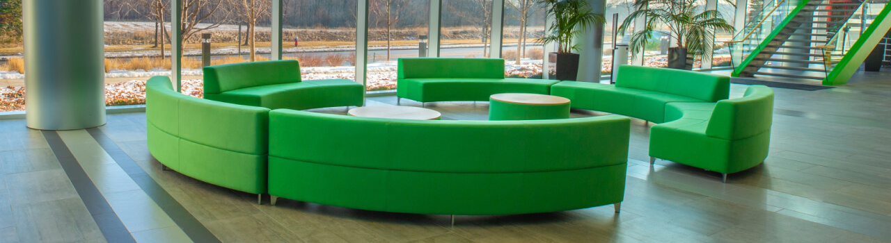 A banner image showing a green couches on the floor.