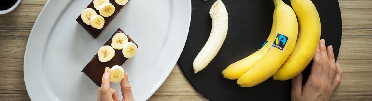 This banner image shows a person decorating pastries with bananas.