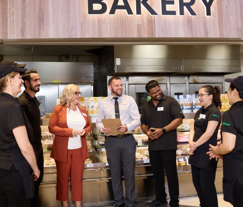 An image showing Sobeys employees standing together and smiling.